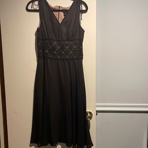 Sleeveless sexy black flowy dress with lace waist detail